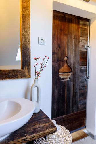 a bathroom with a sink and a mirror at ABC apartments in Kamnik