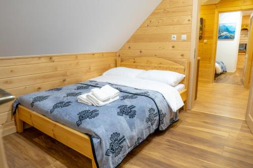 Postel nebo postele na pokoji v ubytování Apartamenty Aleksandra