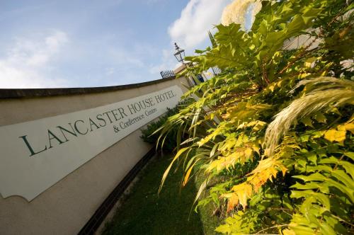 a sign on the side of a building at Lancaster House Hotel in Lancaster