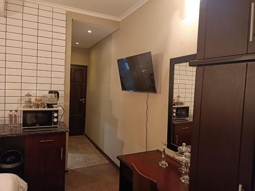 Kuchyň nebo kuchyňský kout v ubytování Apartment A8 inside Bains Lodge
