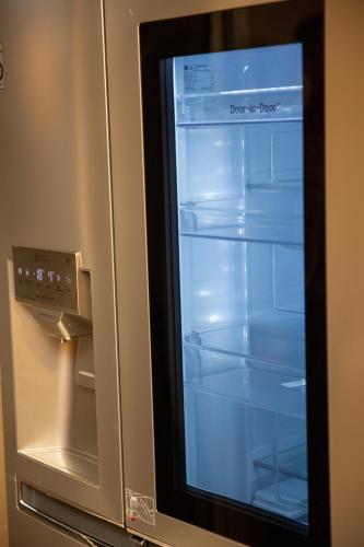 a refrigerator with its door open with the words dont the fridge at AeroChic in Nouaceur