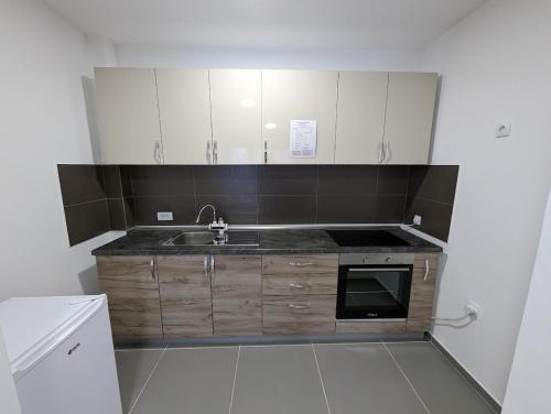Kuchyň nebo kuchyňský kout v ubytování APARTMAN Verona