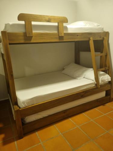 a couple of bunk beds in a room at San Jeronimo Cabaña in San Jerónimo