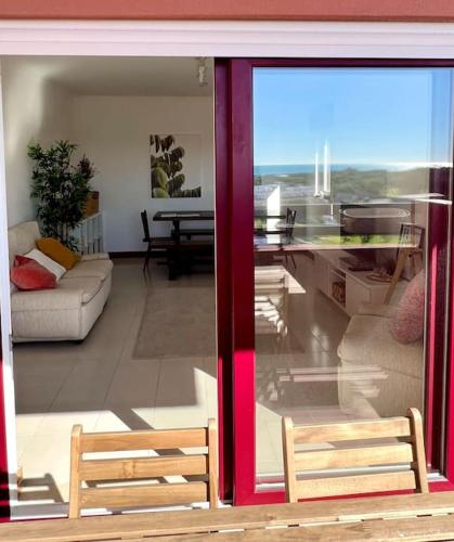 a living room with a view of a living room at T3 beach front in São João da Caparica in Costa da Caparica