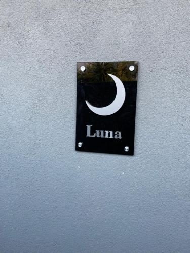 a sign on a wall that says luna on it at Affittacamere Sole e Luna in Castel San Giorgio