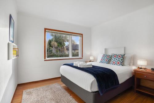 Ein Bett oder Betten in einem Zimmer der Unterkunft Orewa Kiwi Cabins