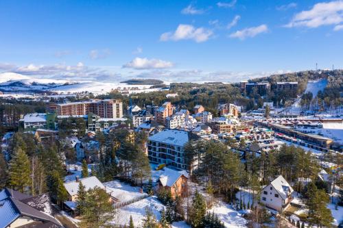 an aerial view of a city in the snow at Apartman DanKa in Zlatibor