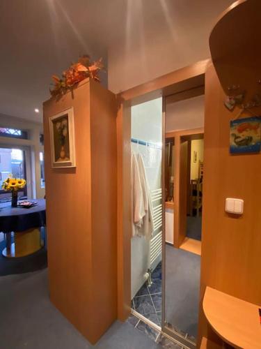 a bathroom with a glass door and a mirror at Apartmán PEPO Smokovec in Starý Smokovec
