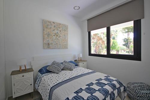 Postel nebo postele na pokoji v ubytování Sun&Beach Carihuela