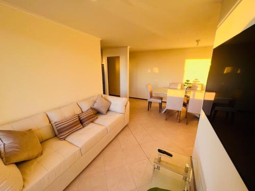 a living room with a couch and a table at Departamento vista al mar 3 habitaciones 2 baños in Constitución