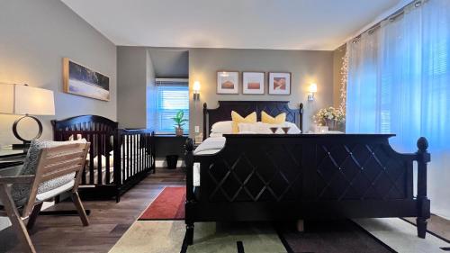 a bedroom with a large black bed and a desk at Modern/Luxury 2 bdrm- KING Bed- University City in Philadelphia