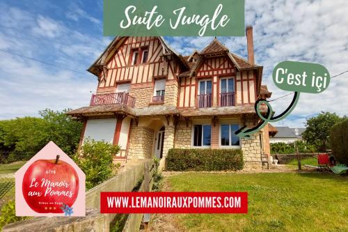 dom z napisem przed nim w obiekcie SUITE JUNGLE - JARDIN, NETFLIX et PARKING - Le Manoir aux Pommes w mieście Orbec-en-Auge