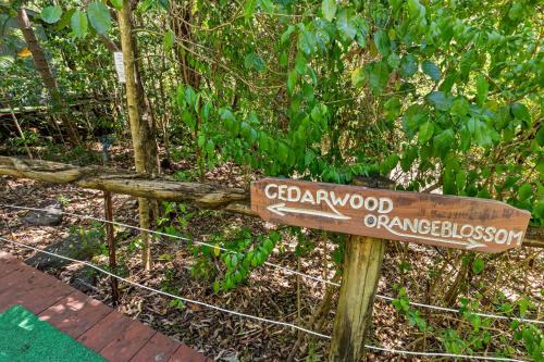 a wooden sign in front of a fence at Hunchy Hideaway in Montville