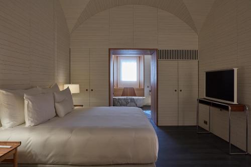 Cama o camas de una habitación en Casa Palacio PAREDES SAAVEDRA by ATRIO