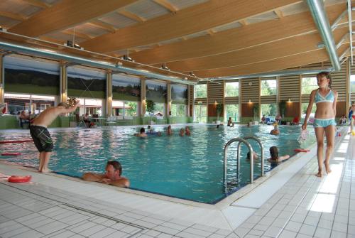 a group of people in a swimming pool at First Camp Enåbadet - Rättvik in Rättvik