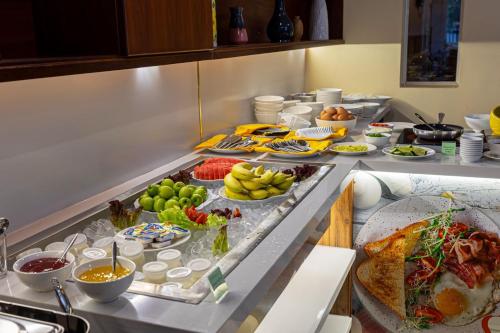 a buffet with many different types of food on a table at THANH TAI HOTEl 1 in Ho Chi Minh City