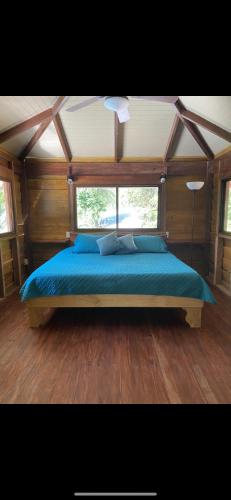 a bedroom with a large bed in a tent at Casita Dulce in Pavones