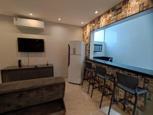 TV a/nebo společenská místnost v ubytování Recanto Dubay