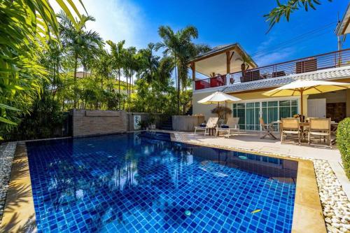 a swimming pool in the backyard of a house at 3 Bedroom Pool Villa in Great Location STV in Hua Hin