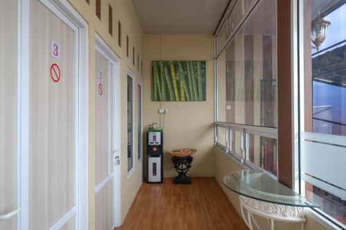 a hallway with a glass table and a vending machine at RedDoorz Syariah near Alun Alun Wonosobo 3 in Wonosobo