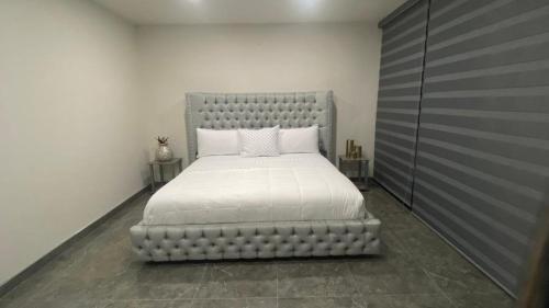 Katil atau katil-katil dalam bilik di Suites Marvento