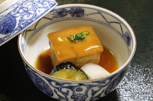 a blue and white bowl with food in it at Rockwood Hotel & Spa in Ajigasawa