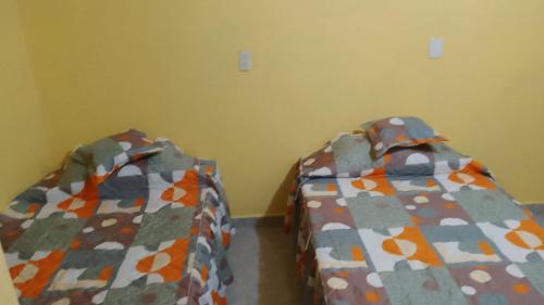 Una cama o camas en una habitación de El Rincón del Ángel Tuxpan
