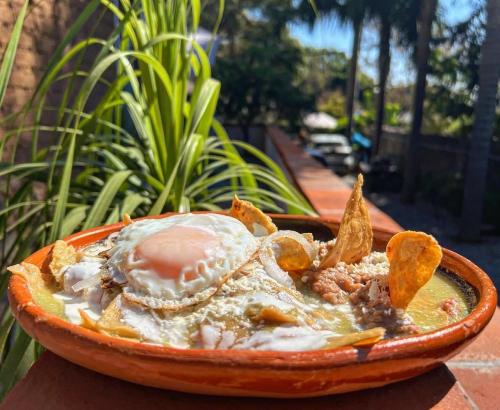 a bowl of food with an egg on top at Hospedaje Casa Teotleco in Tepoztlán