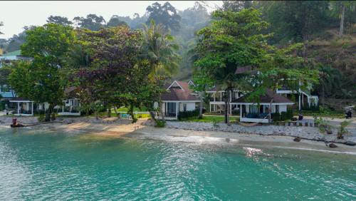 an aerial view of a house next to the water at Sea Escape Koh Chang in Ko Chang