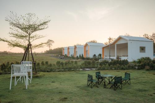 a group of chairs and tables in a field at DOO KHAO in Ban Chong Tako