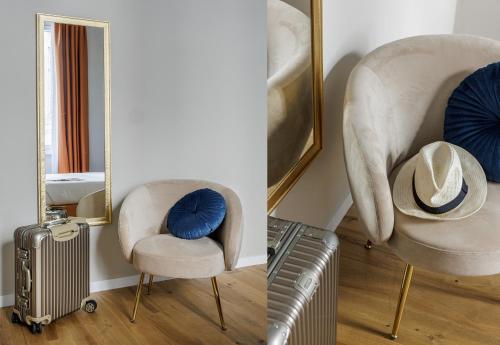 a room with a chair and a hat and a mirror at Dimora72 Luxury Rooms in Florence