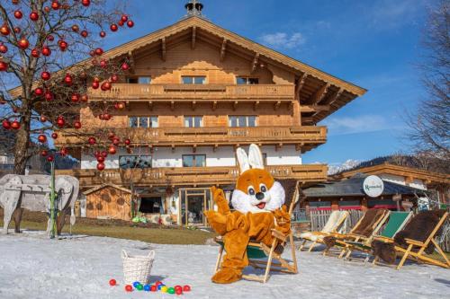 a person dressed in a bunny costume in front of a building at Rasmushof - Hotel Kitzbühel in Kitzbühel