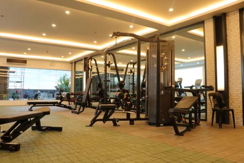 a gym with cardio equipment in a building at Rizal Park Hotel in Manila