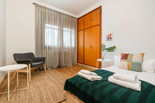 Ένα ή περισσότερα κρεβάτια σε δωμάτιο στο Lodging Apartments Villa el Raco