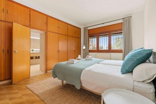 Postel nebo postele na pokoji v ubytování Lodging Apartments Villa el Raco