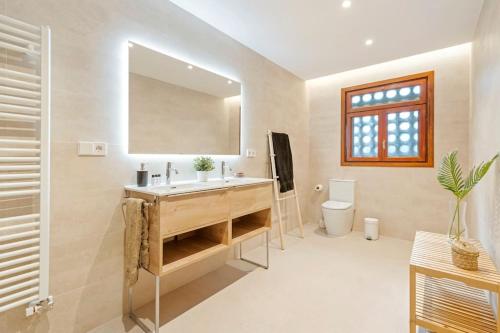 Ένα μπάνιο στο Lodging Apartments Villa el Raco