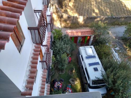 an aerial view of a rv parked next to a house at Hostal Casa del Montañista in Huaraz