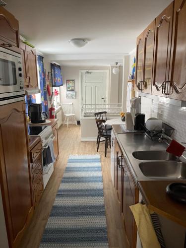 a kitchen with a sink and a counter top at Carina & Peters Place in Kristdala