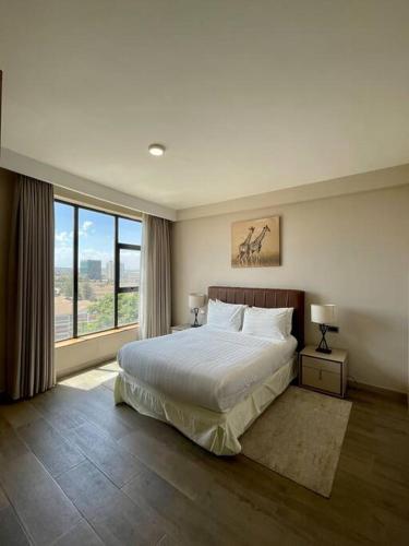En eller flere senge i et værelse på A Scenic Escape within Nairobi