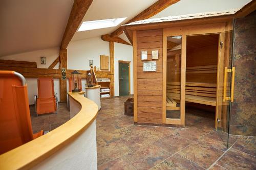 a room with a large room with a glass door at Gasthof-Hotel Zur Post Samerberg in Törwang