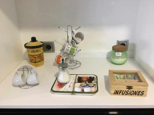 a kitchen counter top with various items on it at Gran piso alto LuzDiseño centrico con garaje in León