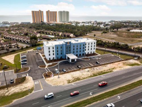 an aerial view of a building with a highway at Comfort Inn & Suites Panama City Beach - Pier Park Area in Panama City Beach