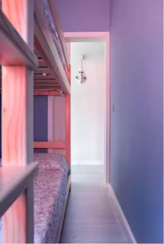 a room with two bunk beds and a white door at Casa Davide in Sottomarina