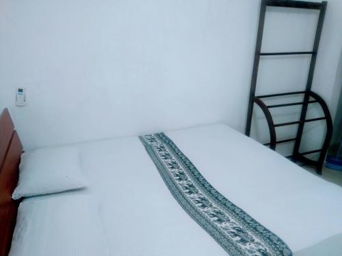 Katil atau katil-katil dalam bilik di Sigiriya Guest House Inamaluwa