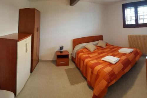 Krevet ili kreveti u jedinici u okviru objekta Appartamento Al Camino