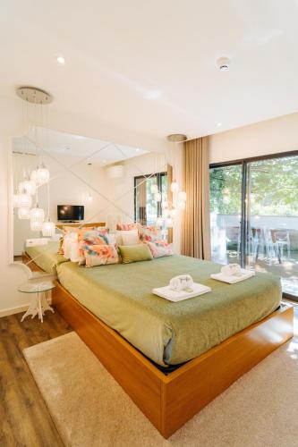 a bedroom with a large bed in a room at Quinta do Pomar Maior in Arouca