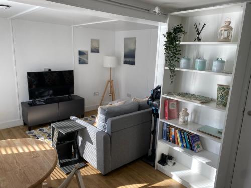 a living room with a couch and a table at Talybont Bed and Breakfast in Barmouth