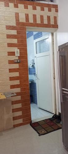 a door in a room with a wall at NUBA ONe in Aswan