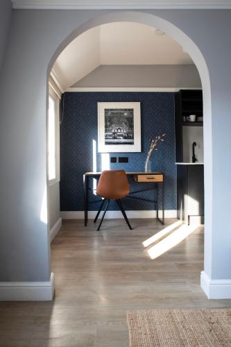 a dining room with a table and a chair at Bob W London Paddington in London