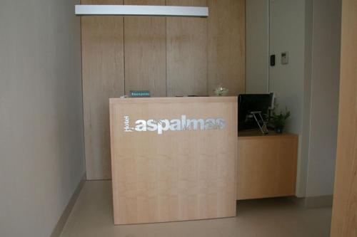 an office with a sign on top of a desk at Hotel Las Palmas in Carboneras